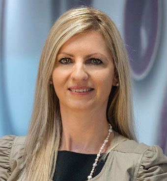 Head and shoulders of Ms Julija Deleva, Branch Manager, Corporate Services, wearing a beige jacket.