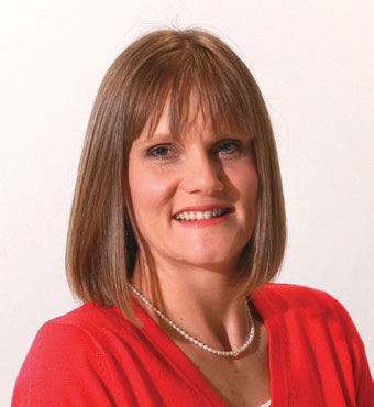 Head and shoulders of Ms Sarah Howard, Branch Manager, Research Excellence, wearing bright red top.