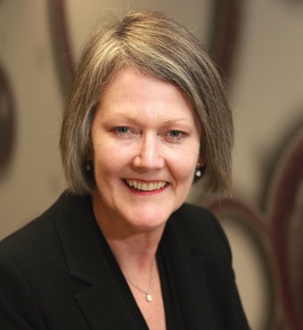 Head and shoulders of Professor Sue Thomas, Chief Executive Officer, wearing a black jacket.
