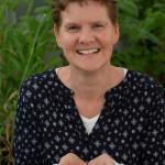 Rachel Burton holding some grains