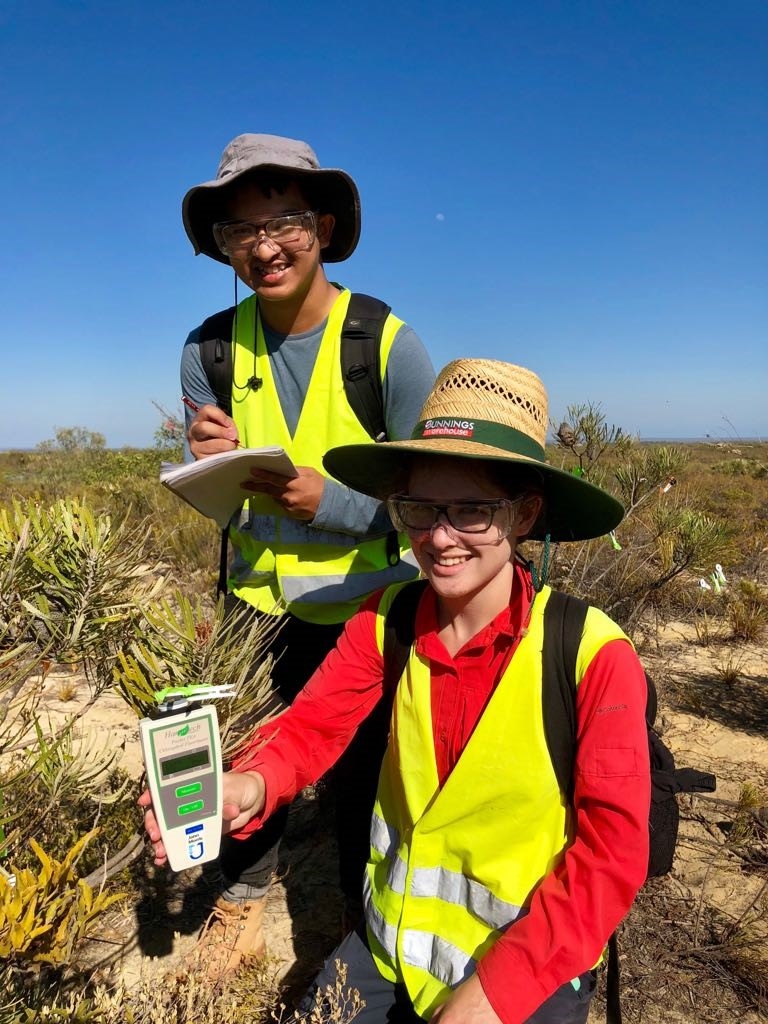 Part of the CMSR team testing new hand-held monitors for determining plant health in restoration.