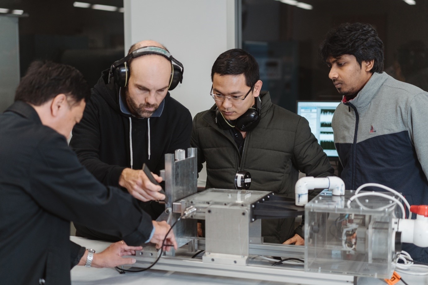 Caption: Buyung Kosasih, Andrew Johnstone, Le Quang Phan, and Rubel Ahmed Laboratory test equipment at UOW for impinging planar jet research: 1:1 scale to industry jet. Credit: Craig Holbrook. Caption: Buyung Kosasih, Andrew Johnstone, Le Quang Phan, and Rubel Ahmed Laboratory test equipment at UOW for impinging planar jet research: 1:1 scale to industry jet. Credit: Craig Holbrook.