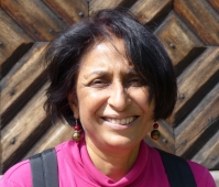 Professor Svetha Venkatesh Headshot of Professor Svetha Venkatesh standing outside. Wood patterned background