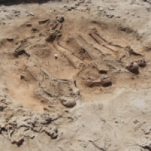 The communal grave discovered by archaeologists was made up of five sets of human remains, along with artefacts. The communal grave discovered by archaeologists was made up of five sets of human remains, along with artefacts.