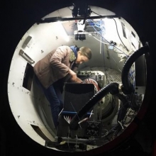 A/Prof Julia Bryant from the University of Sydney inside the SAMI instrument at the top end of the Anglo Australian Telescope. CREDIT Scott Croom/University of Sydney A/Prof Julia Bryant from the University of Sydney inside the SAMI instrument at the top end of the Anglo Australian Telescope. CREDIT Scott Croom/University of Sydney