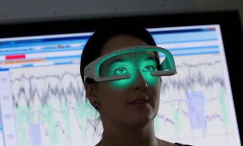 Image: ‘Re-Timer’ glasses radiates a soft, green UV-free light. Image Credit: Flinders University.