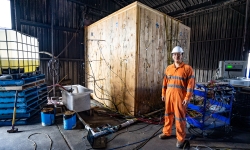 PhD Student, Hangyu Xu, in front of the fire test room. Credit: ARC Future Timber Hub.