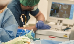 Team members testing the smart needle in surgery.