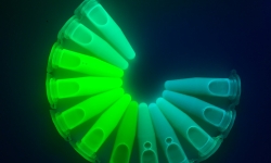 The tuneable emission colour of a solution of various bromide based perovskite nanocrystals under UV light. Credit: Dr Wenping Yin.