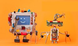 iStock-666003450 – Robots friends ready for service repair. Funny robotic characters with instrument, pliers hand wrenches. Smile message blue screen monitor, cyborg electric wires hairstyle, circuits. Orange background stock photo