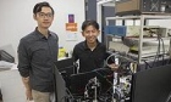 Image: Yongxiao Li and Dr Steve Lee with the advanced microscope they built.