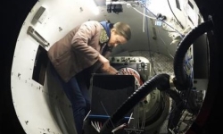 A/Prof Julia Bryant from the University of Sydney inside the SAMI instrument at the top end of the Anglo Australian Telescope. CREDIT Scott Croom/University of Sydney A/Prof Julia Bryant from the University of Sydney inside the SAMI instrument at the top end of the Anglo Australian Telescope. CREDIT Scott Croom/University of Sydney