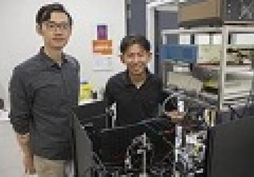Image: Yongxiao Li and Dr Steve Lee with the advanced microscope they built.