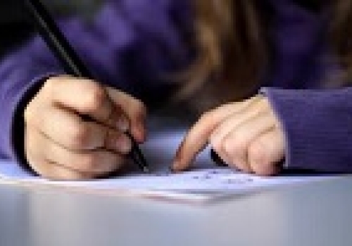 Image: A kid drawing or writing. Image: A kid drawing or writing. Image credit: Wikimedia Commons.