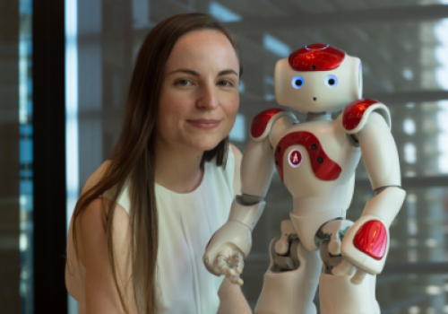 Dr Nicole Robinson with a NAO. Dr Nicole Robinson with a NAO.