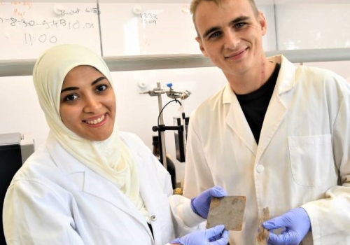 Lead author on the paper, international masters student Ms Israa Bu Najmah, left, and postgrad Nic Lundquist, with samples of the composite and Border Leicester fleece in the Chalker organic chemistry laboratory at Flinders University, Adelaide South Aust Lead author on the paper, international masters student Ms Israa Bu Najmah, left, and postgrad Nic Lundquist, with samples of the composite and Border Leicester fleece in the Chalker organic chemistry laboratory at Flinders University, Adelaide South Aust
