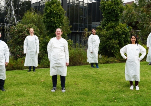 Researchers wearing PPE they developed Researchers wearing PPE