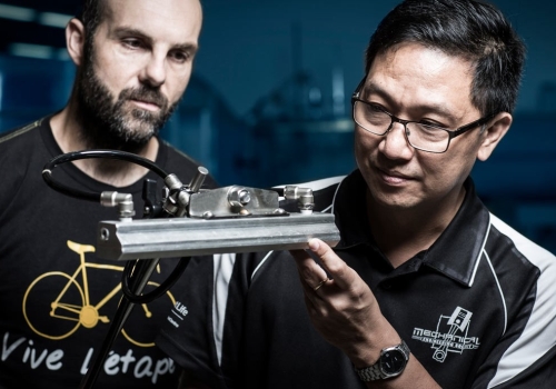 Caption: Andrew Johnston and Buyung Kosasih, assessing the performance of the Mark I slotted air jet laboratory equipment. Credit: Paul Jones. Caption: Andrew Johnston and Buyung Kosasih, assessing the performance of the Mark I slotted air jet laboratory equipment. Credit: Paul Jones.