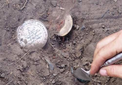 Image: Josephson’s ointment pot lid being excavated from a rubbish pit at the Boralga (Laura), Native Police camp, Cape York. Image credit: Flinders University. Image: Josephson’s ointment pot lid being excavated from a rubbish pit at the Boralga (Laura), Native Police camp, Cape York. Image credit: Flinders University.