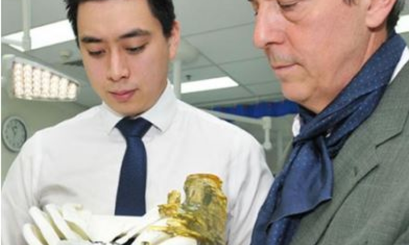 Professor Hutmacher (R) demonstrating the chest implant with Dr  Matthew Cheng (L). Credit: Metro South Health.