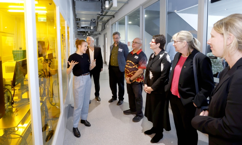 Guests at the FLiQC launch view laboratory facilities during a guided walkthrough at the University of Sydney.
