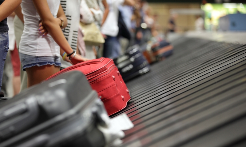 visitors waiting for luggage at Changi Airport