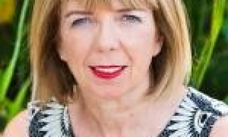 Headshot of Professor Ann McGrath outside infront of plants